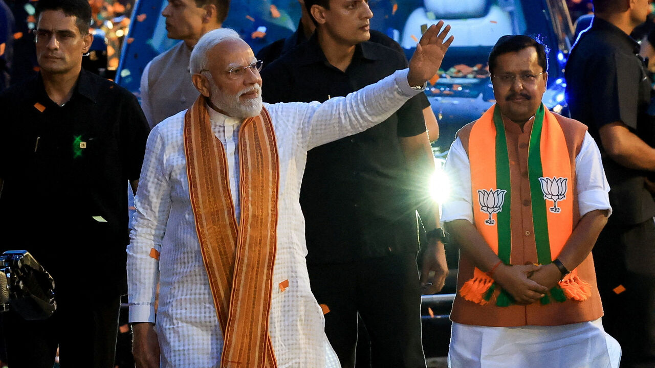 India's Prime Minister Narendra Modi greets his supporters as he arrives at the Bharatiya Janata Party (BJP) headquarters in New Delhi, India, May 4, 2026. REUTERS/Adnan Abidi/File Photo