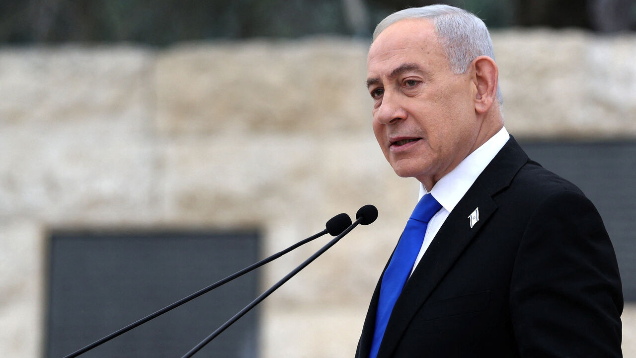 Israel’s Prime Minister Benjamin Netanyahu speaks during a ceremony commemorating Israel’s Remembrance Day for fallen soldiers, or Yom HaZikaron, at the Military Cemetery on Mount Herzl in Jerusalem April 21, 2026.     ILIA YEFIMOVICH/Pool via REUTERS