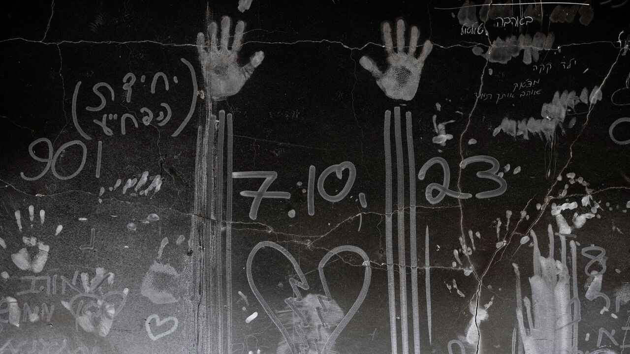 Hand prints and other markings made in the soot on a wall are seen, nearly a year since the deadly October 7 attack by Hamas, in Kibbutz Beeri, southern Israel, September 15, 2024. REUTERS/Amir Cohen