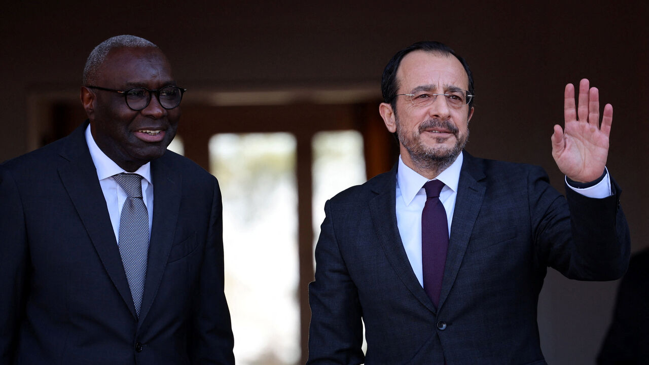UN Cyprus representative Khassim Diagne and  Cyprus President Nikos Christodoulides, who leads Cyprus's Greek Cypriot community are seen before a meeting with Turkish Cypriot leader Tufan Erhurman in the UN buffer zone of the capital Nicosia, Cyprus February 24, 2026. REUTERS/Yiannis Kourtoglou