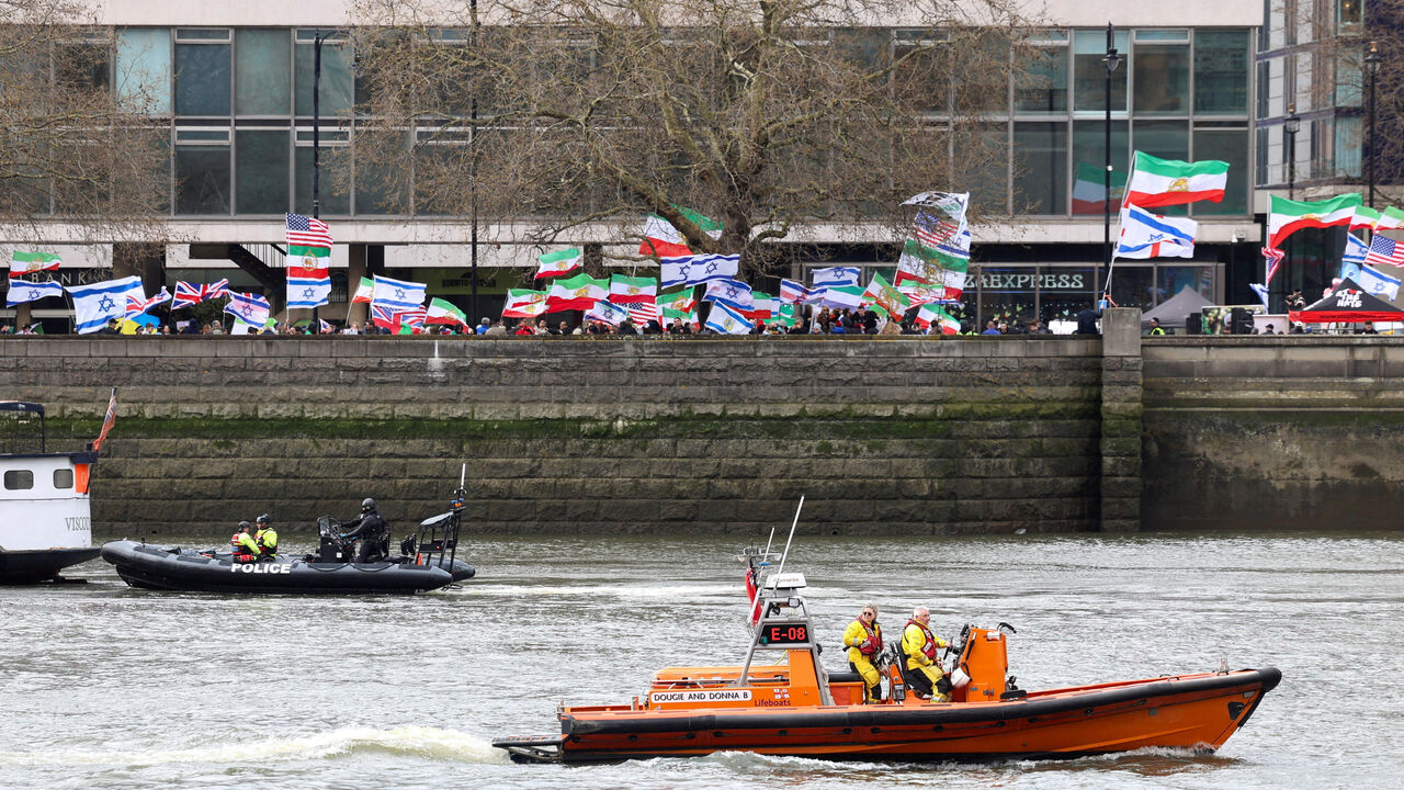 FILE PHOTO: Police officers and a crew of an RNLI lifeboat patrol the River Thames on the day of a static protest to mark Al-Quds Day in support of the Palestinian people organised by the Islamic Human Rights Commission and a counter-protest, in London, Britain, March 15, 2026. REUTERS/Toby Shepheard/File Photo
