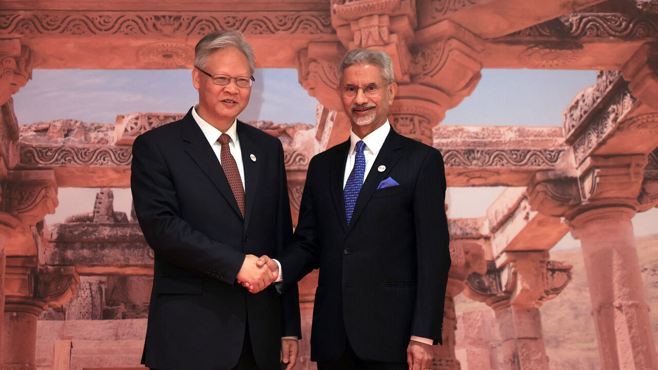 India's Foreign Minister Subrahmanyam Jaishankar shakes hands with China's Ambassador to India Xu Feihong during the BRICS foreign ministers' meeting at Bharat Mandapam in New Delhi, India May 14, 2026. REUTERS/Adnan Abidi