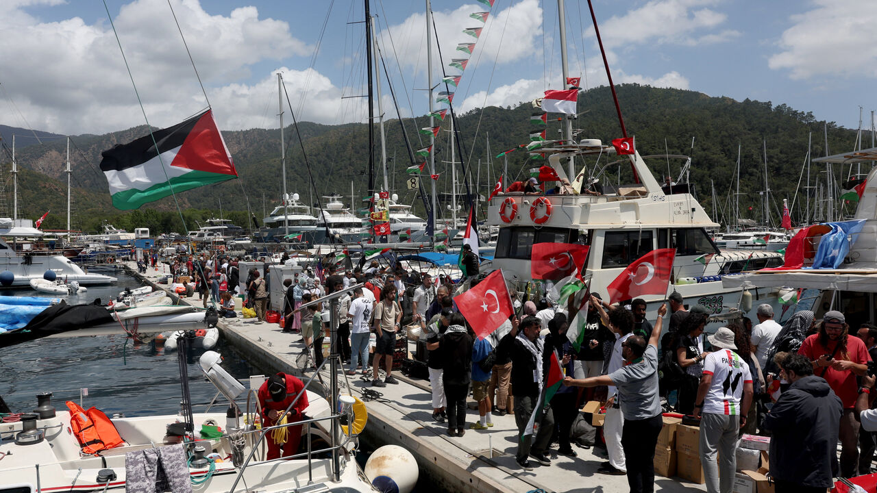 Activists from the Global Sumud Flotilla, aiming to reach Gaza and break Israel’s naval blockade, gather at a port before their departure in the southern Turkish resort of Marmaris, Turkey, May 14, 2026. REUTERS/Dilara Senkaya