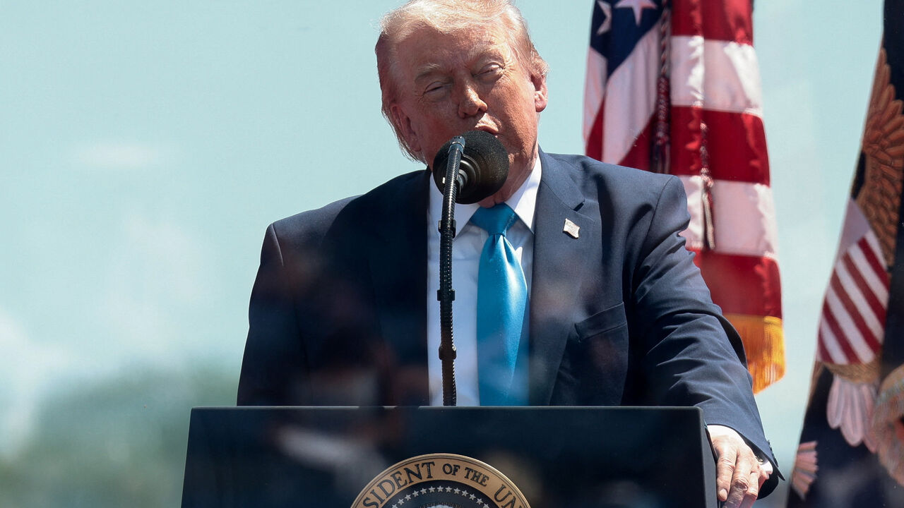 U.S. President Donald Trump stands behind protective glass as he delivers the commencement address at the U.S. Coast Guard Academy in New London, Connecticut, U.S., May 20, 2026. REUTERS/Evelyn Hockstein