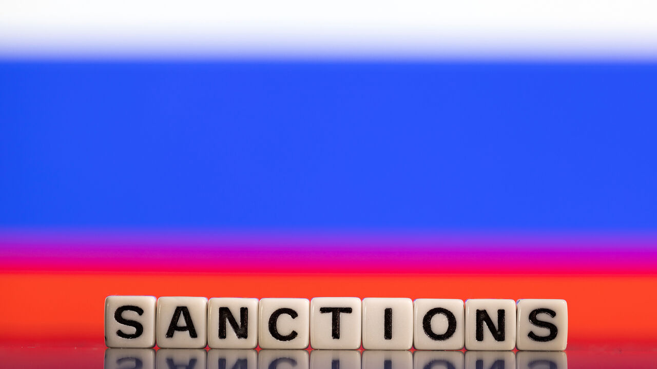 Plastic letters arranged to read "Sanctions" are placed in front of Russian flag colors in this illustration taken February 25, 2022. REUTERS/Dado Ruvic/Illustration