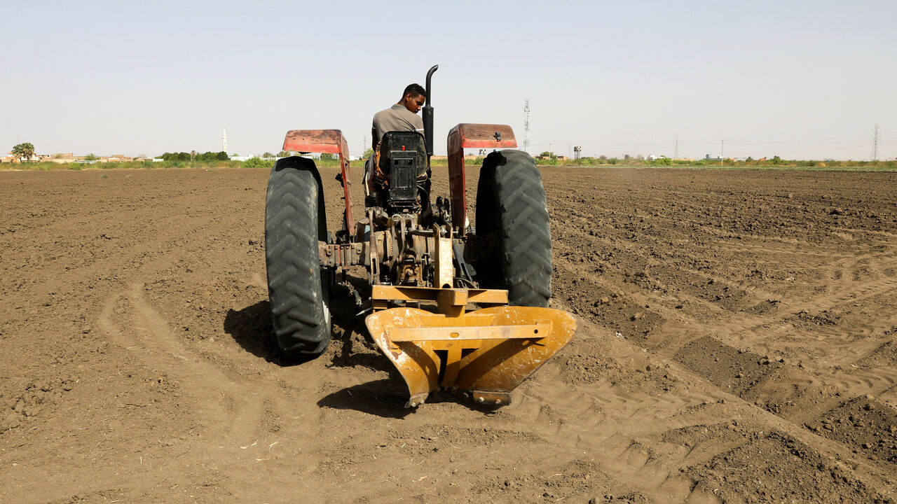 A tractor is used to plow the land at an agricultural project in South Omdurman, Sudan May, 21, 2026. REUTERS/El Tayeb Siddig