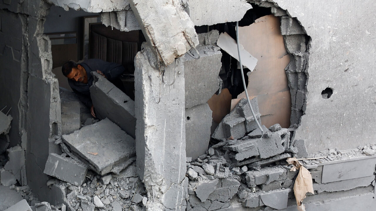 A Palestinian man inspects the site of an Israeli airstrike on a residential building on Tuesday, in Gaza City, May 27, 2026. REUTERS/Mahmoud Isaa