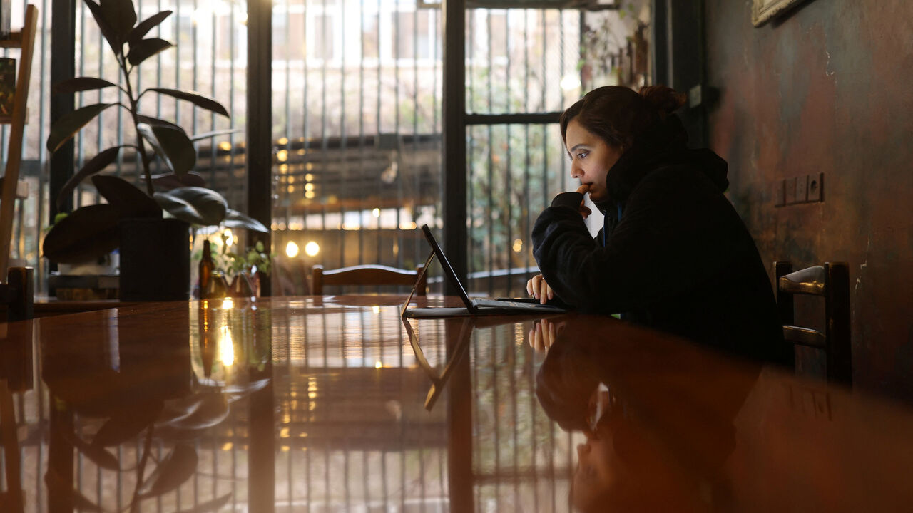 An Iranian woman, Samaneh, tries to connect to the internet to check on her visa status for her migration process, after a nationwide internet shutdown since January 8, 2026, following Iran's protests, in Tehran, Iran, January 25, 2026. Majid Asgaripour/WANA (West Asia News Agency) via REUTERS/File Photo