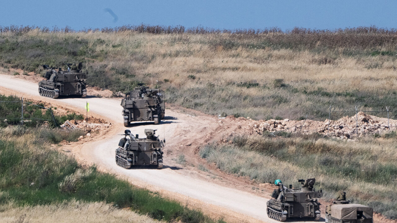 An Israeli military artillery unit drives into Lebanon after crossing the Israeli‑Lebanese border, as seen from northern Israel, May 27, 2026. REUTERS/Rami Shlush