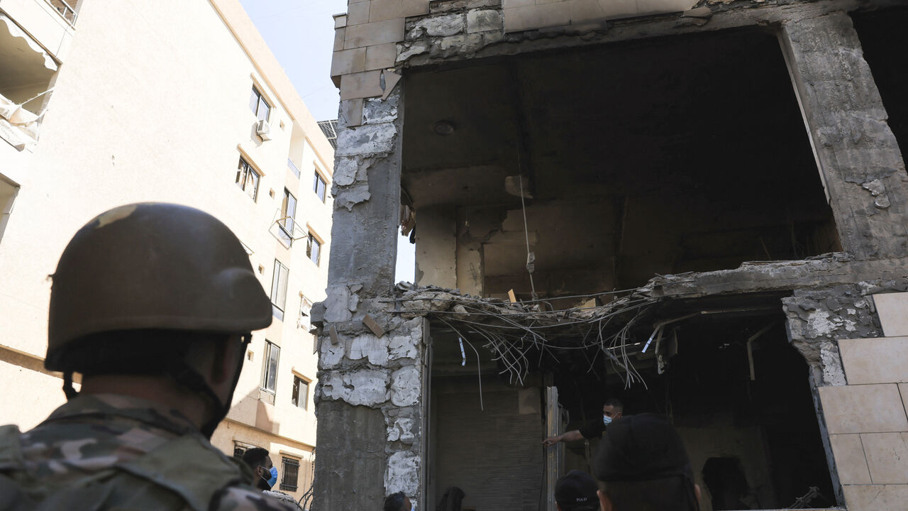 People inspect the damage at the site of an Israeli strike on Beirut's southern suburbs, Lebanon, May 28, 2026. REUTERS/Raghed Waked