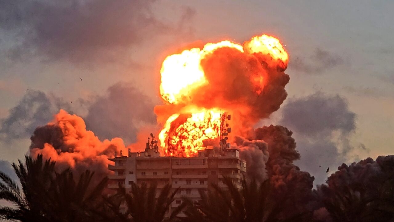 A fireball erupts from a building following an Israeli strike in Tyre
