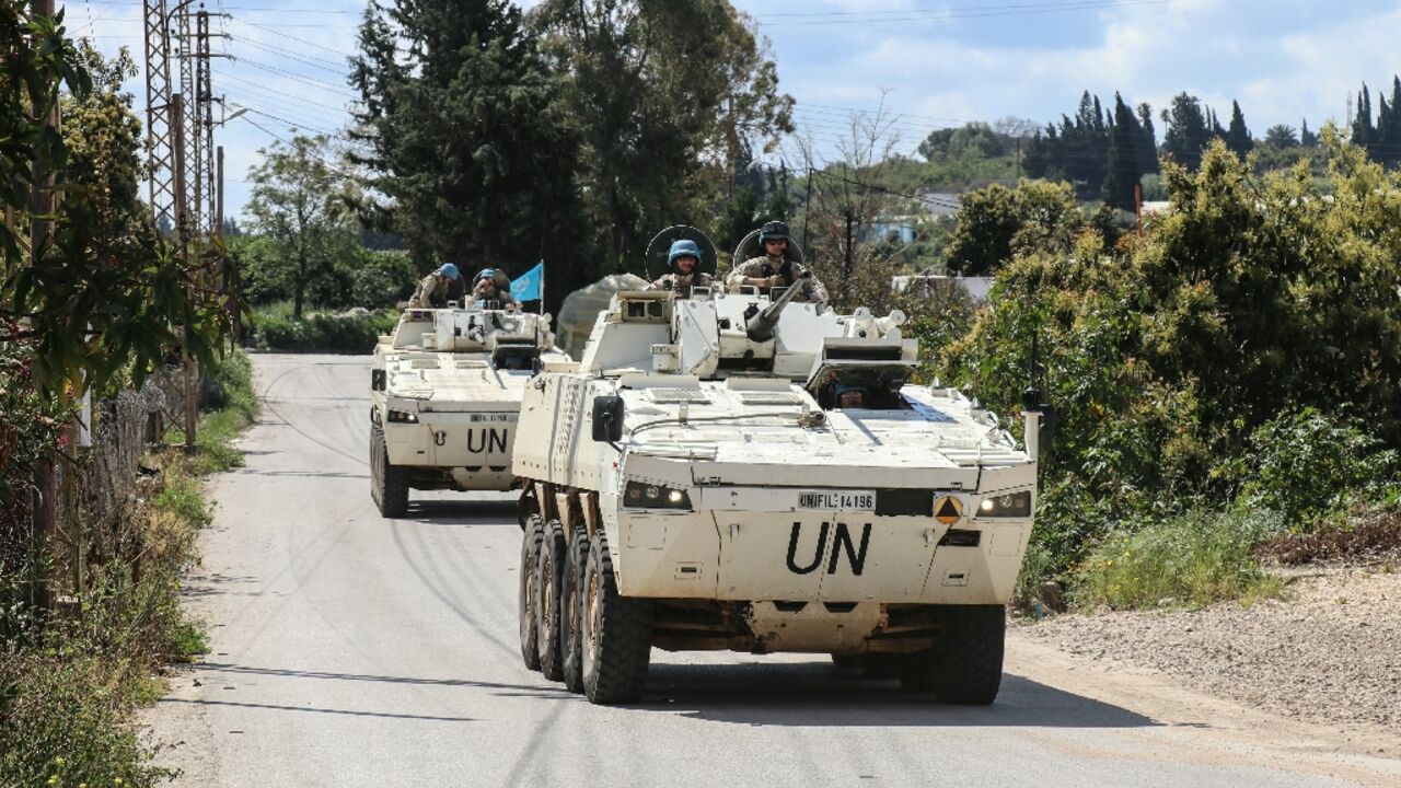Members of the UNIFIL  patrol the road of the southern Lebanese village of Tair Debba on April 12, 2026