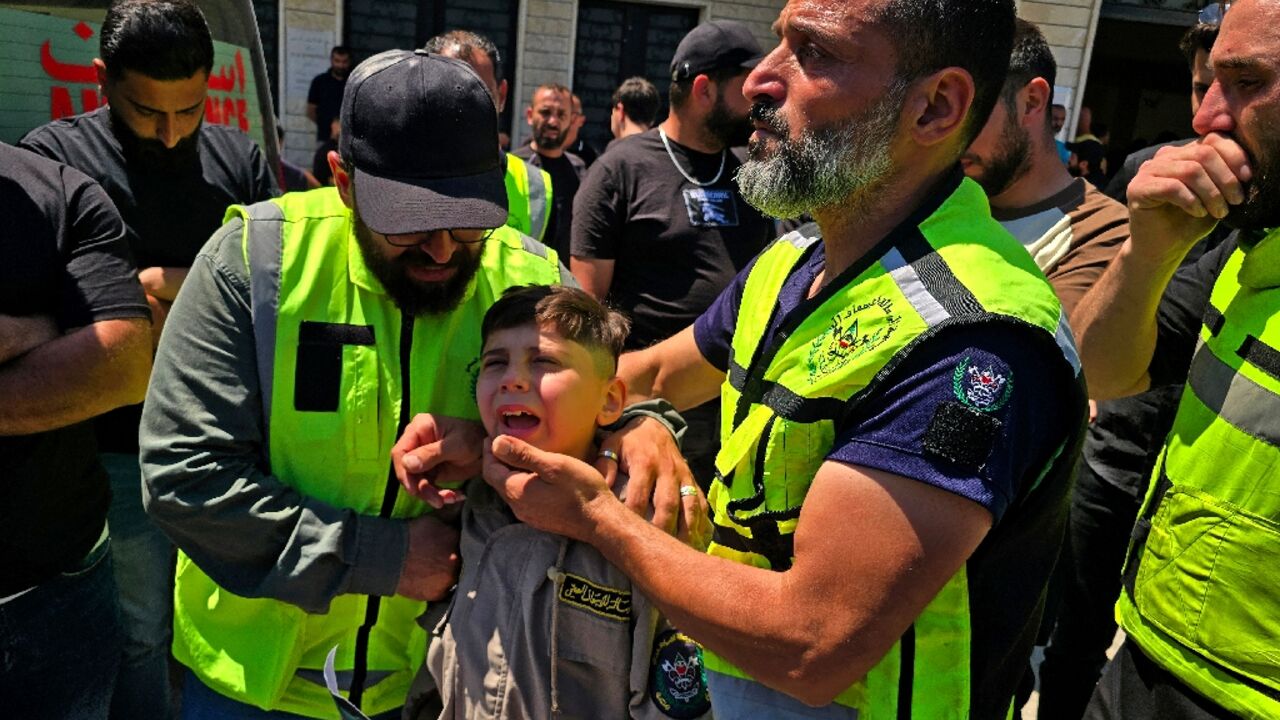 Mourners at the funeral of victims killed in an Israeli strike near Tyre