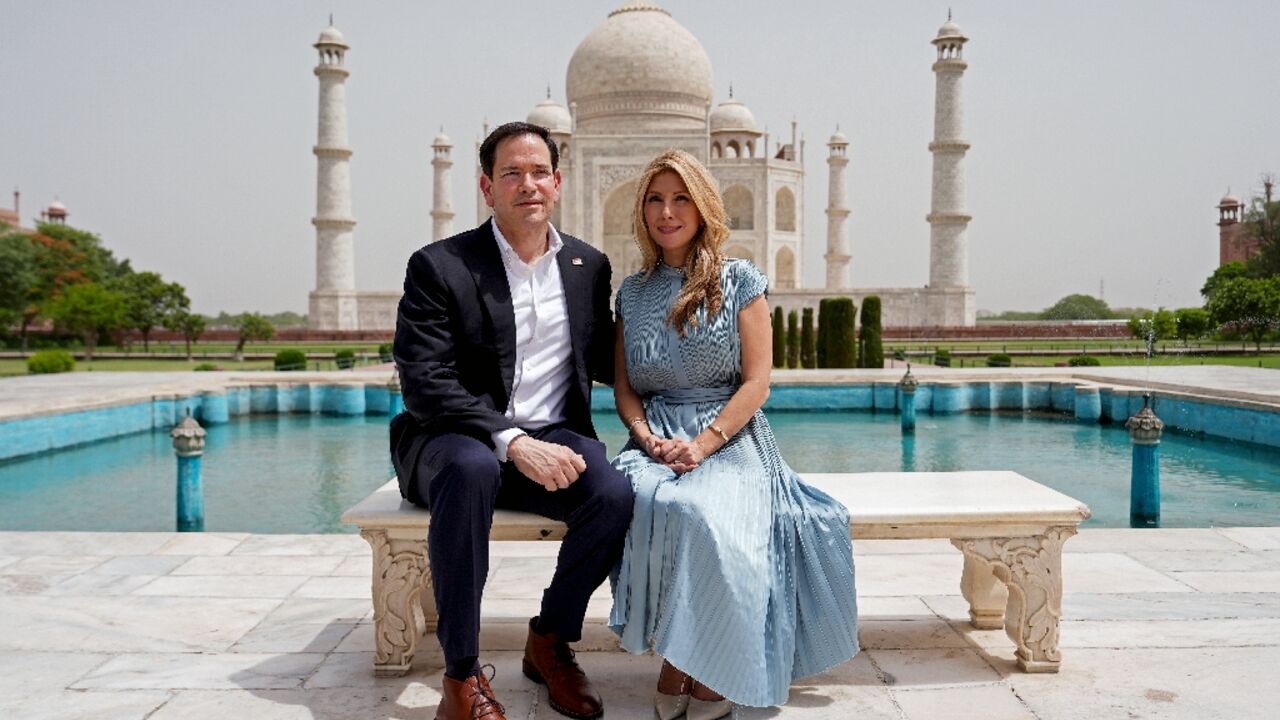 US Secretary of State Marco Rubio poses alongside his wife Jeanette at the Taj Mahal in Agra, India