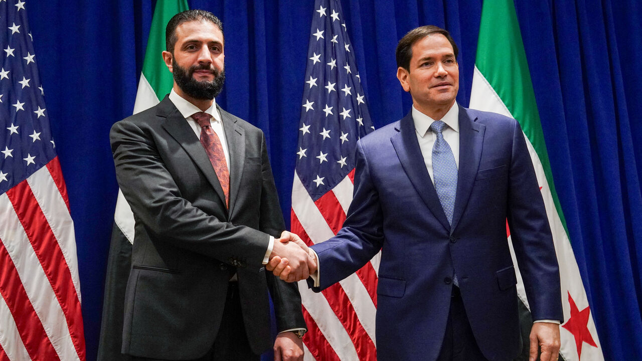TOPSHOT - US Secretary of State Marco Rubio (R) meets with Syrian President Ahmed al-Sharaa at the Lotte New York Palace Hotel on the sidelines of the United Nations General Assembly meeting in New York City on September 22, 2025. (Photo by Bing Guan / POOL / AFP via Getty Images)