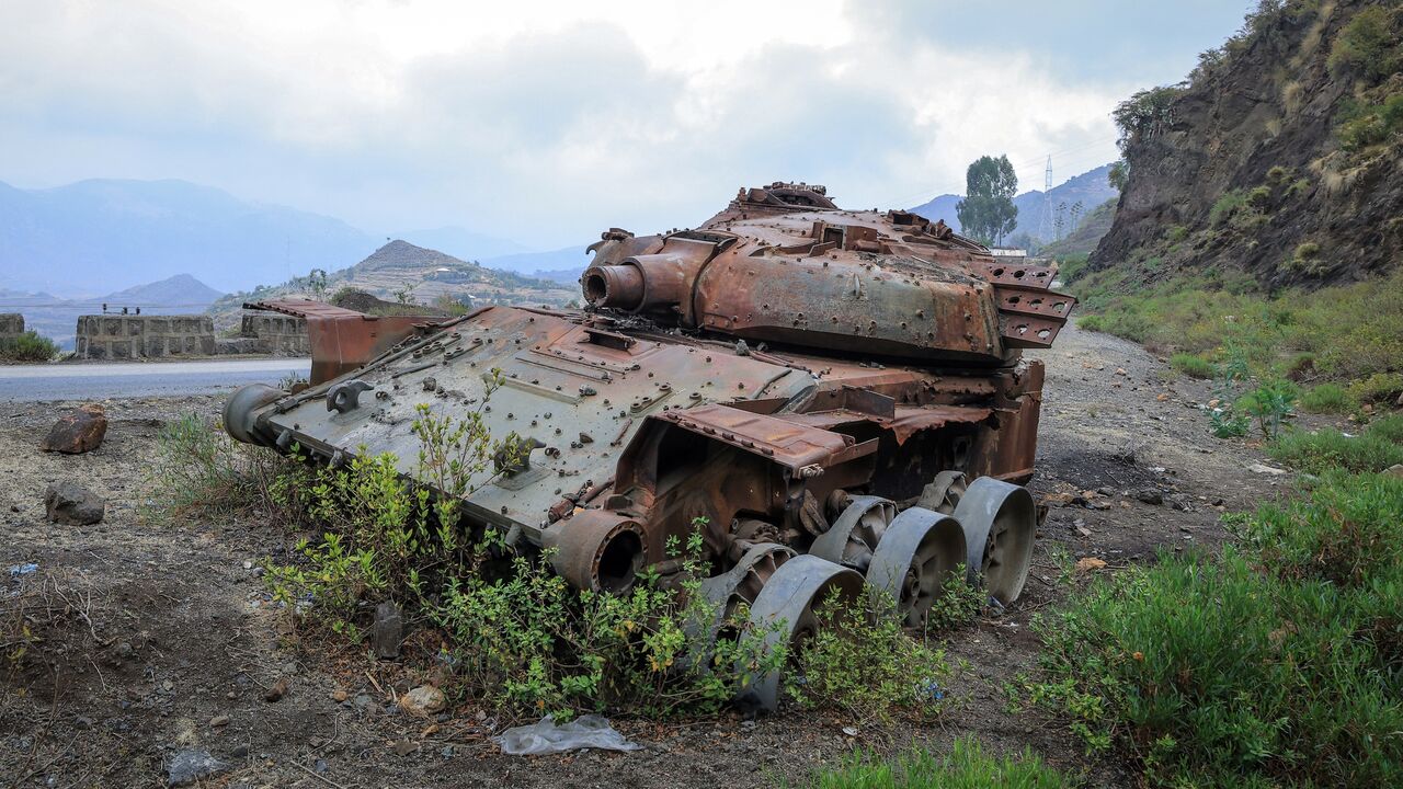 The charred remains of a tank from clashes between the Ethiopian National Defense Force (ENDF) and the Tigray People's Liberation Front (TPLF) lie on a road near Gereb Agew, Southern Tigray, on March 3, 2026.