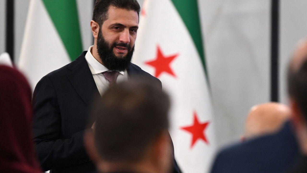Syrian President Ahmed al-Sharaa arrives to attend the second day of the first Syrian-Emirati (United Arab Emirates) Investment Forum, at the People's Palace in Damascus on May 12, 2026. (Photo by LOUAI BESHARA / AFP via Getty Images)