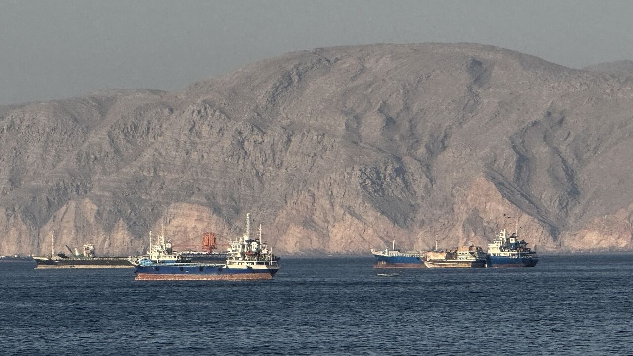 Vessels are seen anchored in the Strait of Hormuz, off the port city of Khasab on Oman's northern Musandam Peninsula on May 17, 2026. 