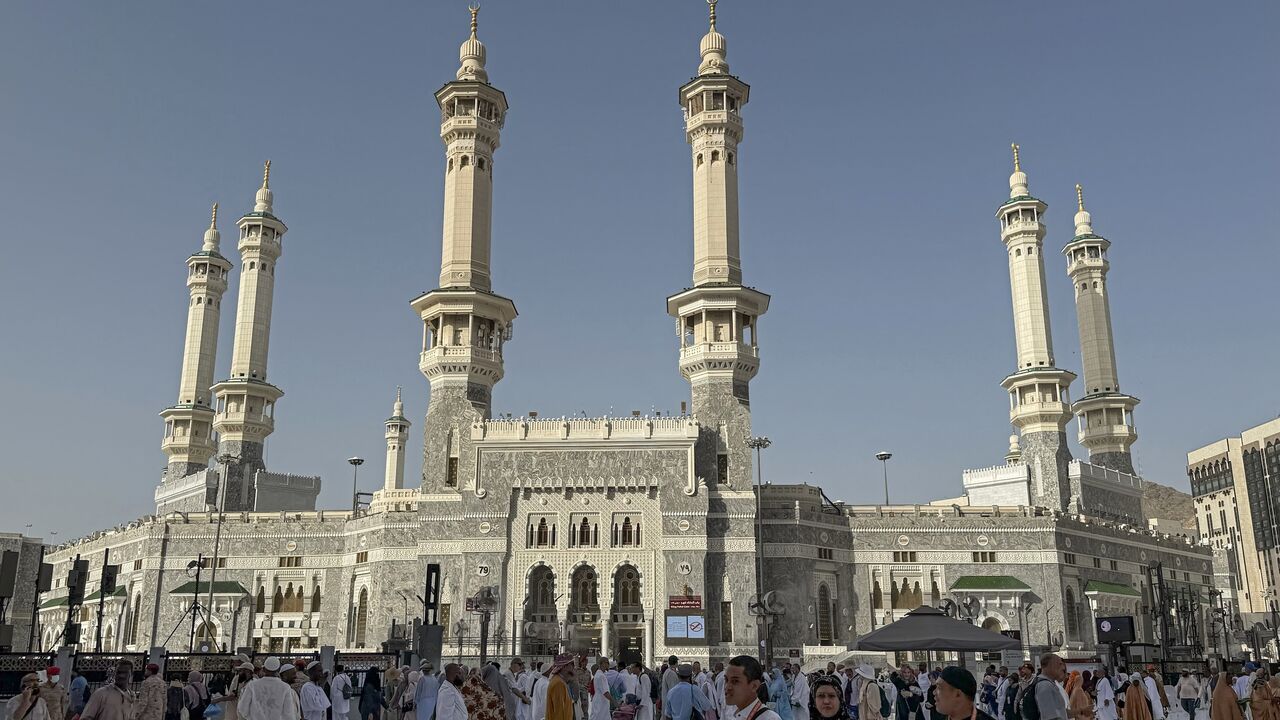 Muslim worshippers walk along the Grand Mosque complex in the holy city of Mecca on May 22, 2026, ahead of the annual Hajj pilgrimage. 