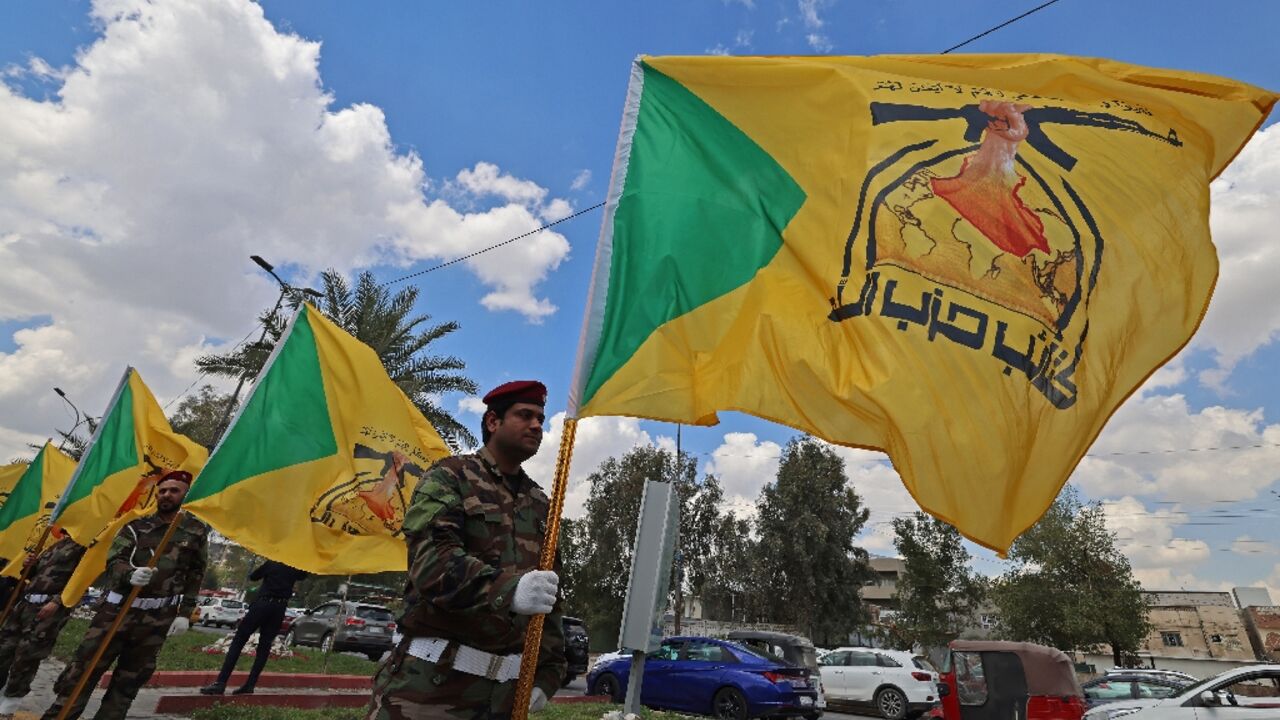 Members of Iraq's pro-Iran paramilitary group Kataeb Hezbollah  mourn a comrade who was killed in a strike in Basra, during the funeral in Baghdad on April 8, 2026