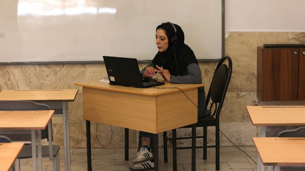 Teacher Faezeh Hasarakizad holds a class online via webcam