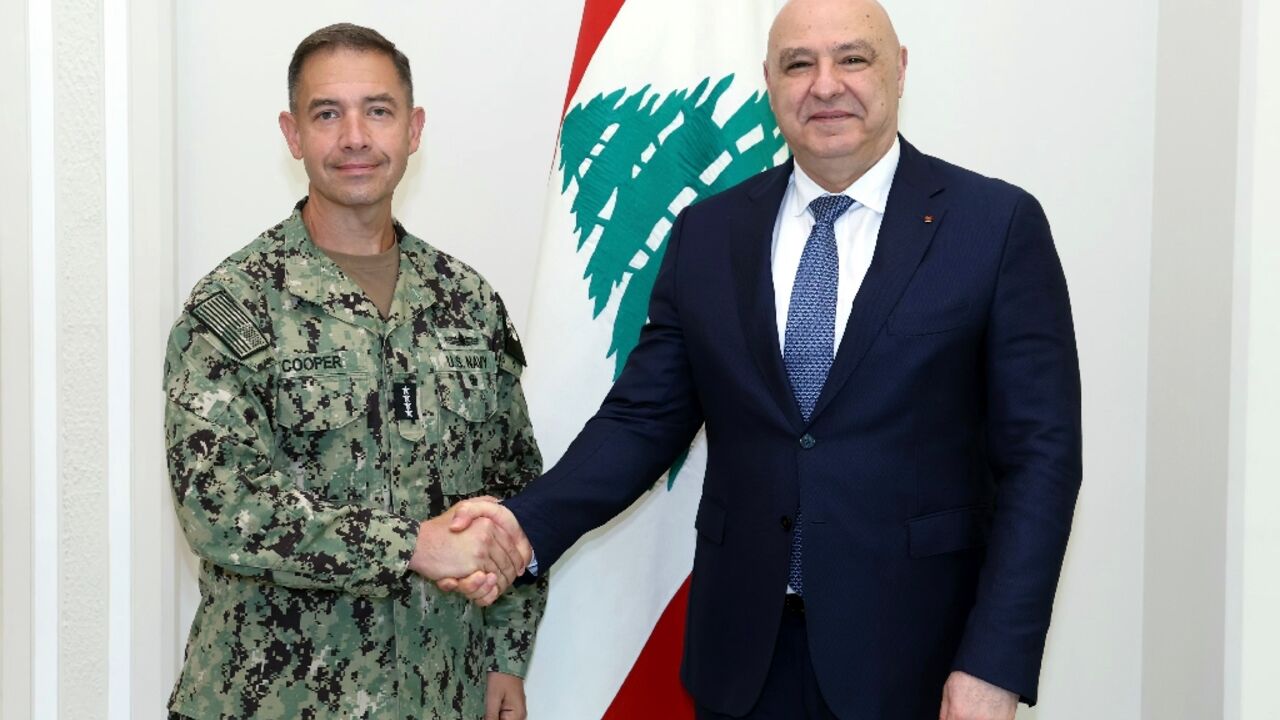 This handout photograph released by the Lebanese Presidency press office shows Lebanon's President Joseph Aoun with Admiral Brad Cooper, the commander of US Central Command (CENTCOM), at the presidential palace in Baabda