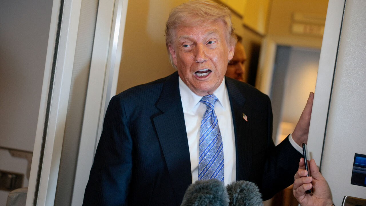 FILE PHOTO: U.S. President Donald Trump speaks to the press aboard Air Force One enroute to the U.S.  following his official visit with President Xi Jinping in China, May 15, 2026. REUTERS/Evan Vucci/File Photo