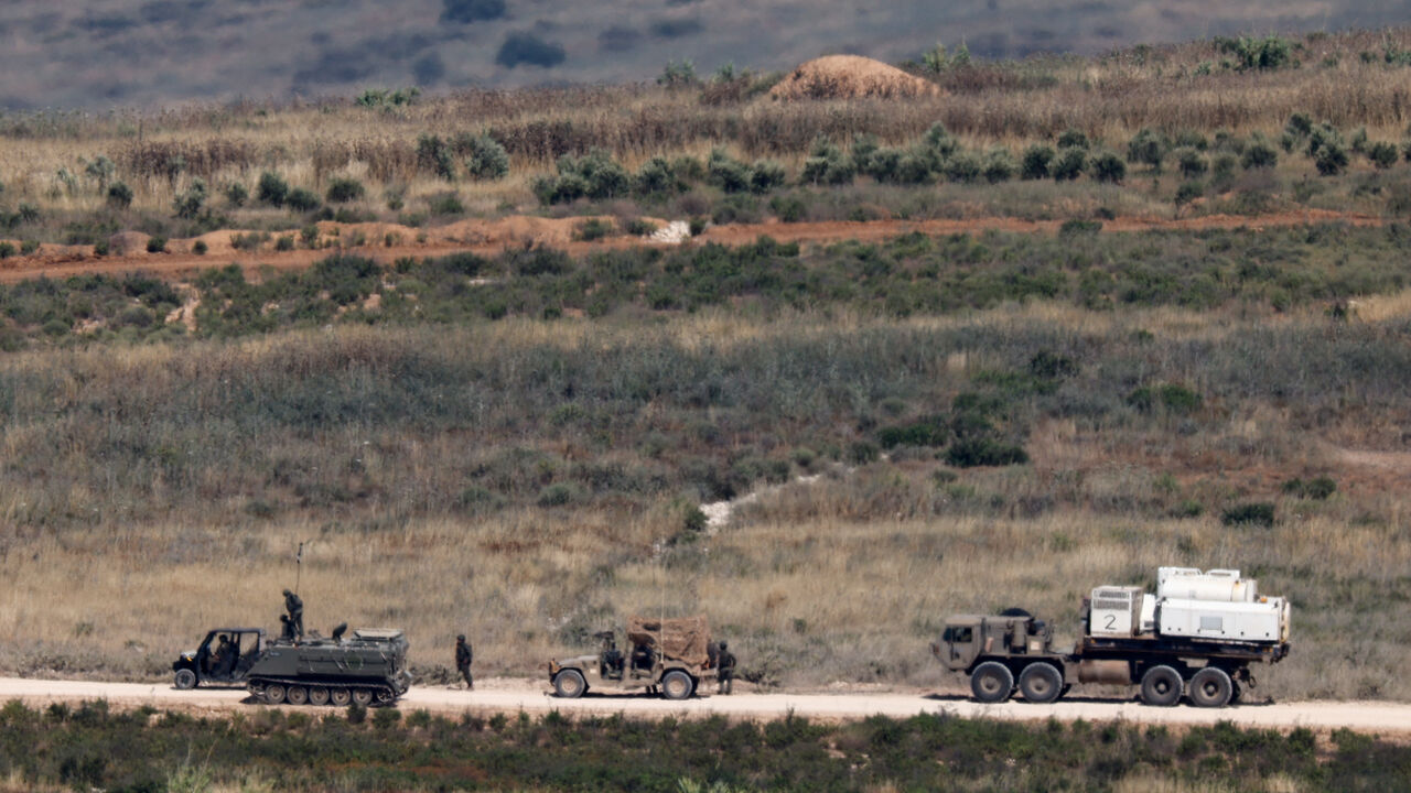 Israeli soldiers near military vehicles in Lebanon, as seen from the Israeli side of the Israeli-Lebanese border, June 1, 2026. REUTERS/Amir Cohen
