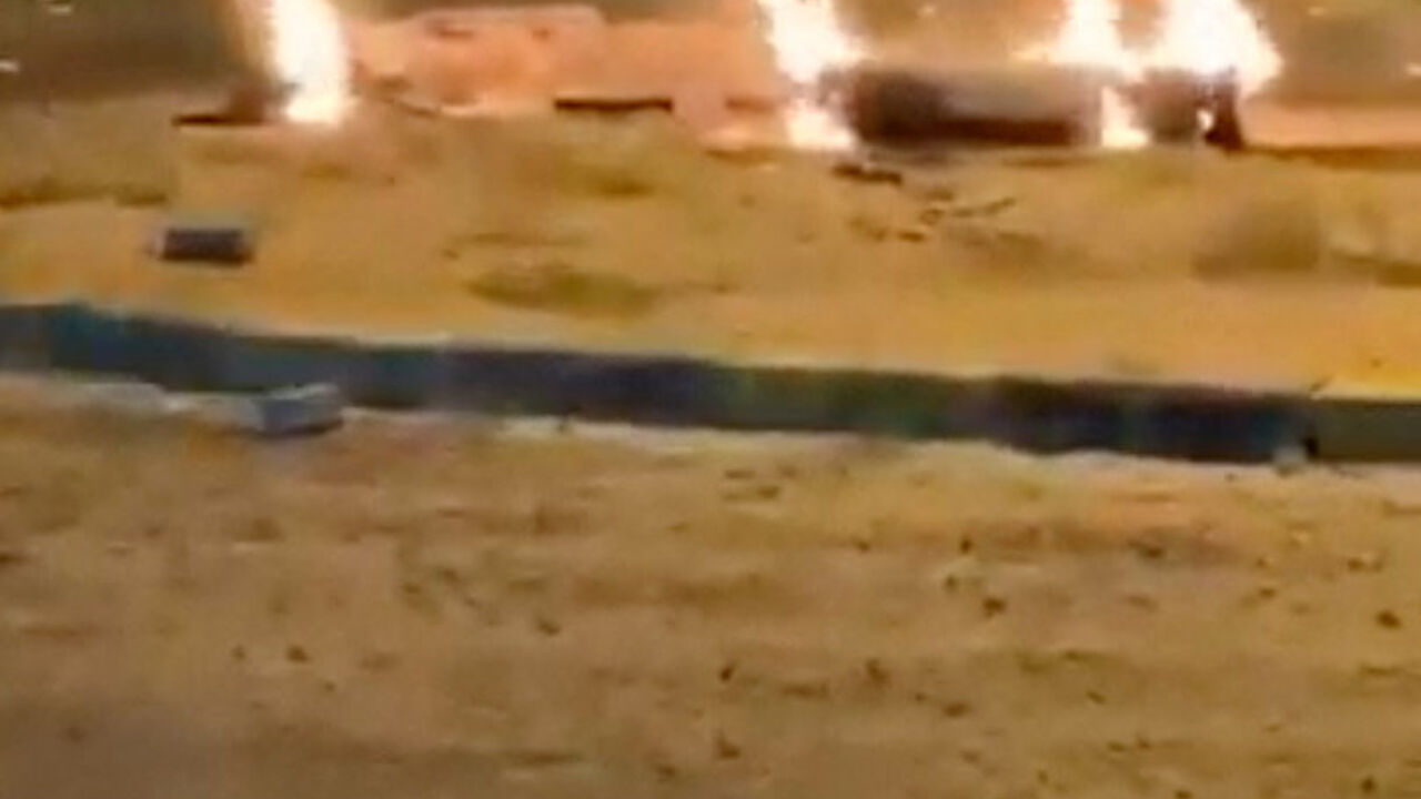 Debris burns on the ground in a parking lot following reports of missile and drone attacks, in Sabah Al Nasser, Kuwait June 3, 2026, in this screengrab obtained from a social media video . SOCIAL MEDIA/via REUTERS
