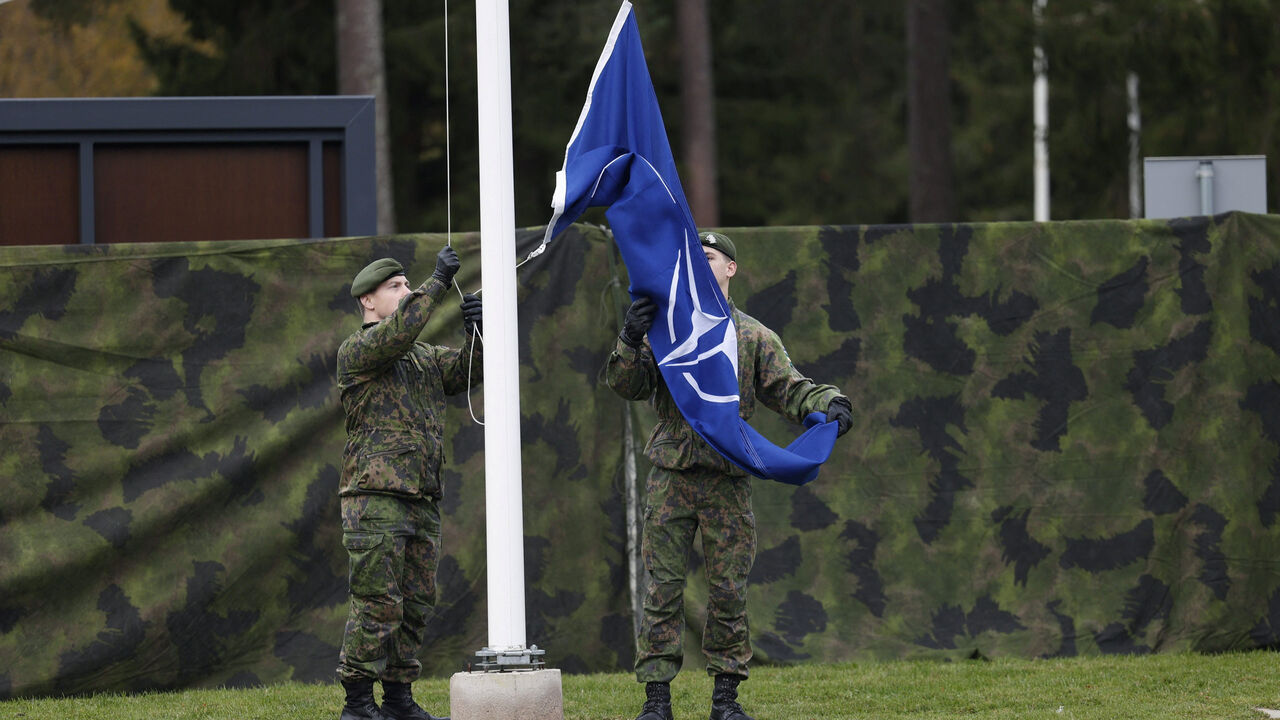 Soldiers handle the NATO flag on the day of the opening ceremony of NATO's Northern Multi-Corps Land Component Command (MCLCC) in Mikkeli, Finland, October 3, 2025. Lehtikuva/Matias Honkamaa/via REUTERS