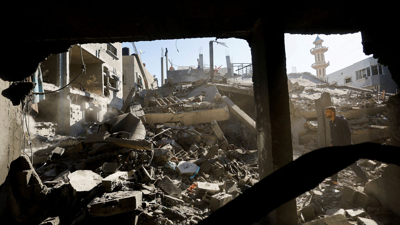 A Palestinian man inspects the site of an Israeli strike on a house whose residents were warned to evacuate before the attack, in Zawayda, central Gaza Strip June 5, 2026. REUTERS/Mahmoud Issa