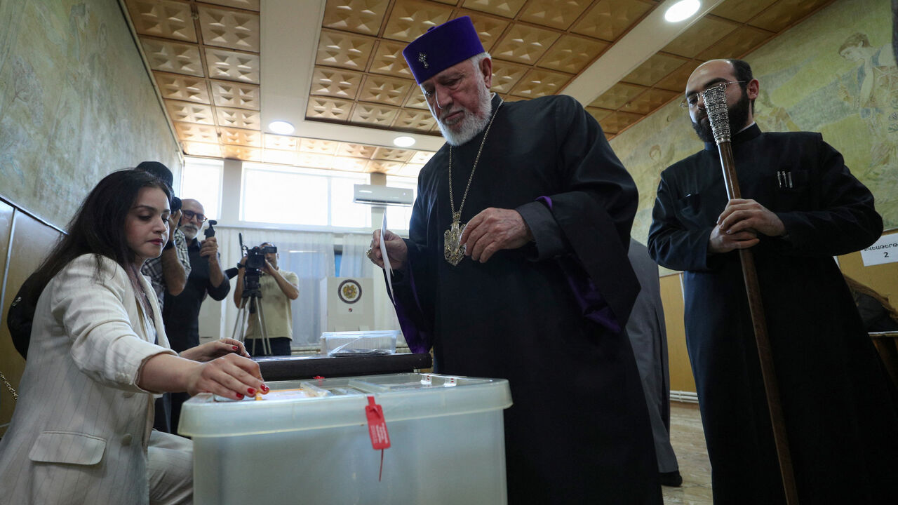 Catholicos Karekin II, head of the Armenian Apostolic Church, waits before casting a ballot at a polling station during a parliamentary election in Vagharshapat (Etchmiadzin community), Armenia, June 7, 2026. Vahram Baghdasaryan/Photolure via REUTERS