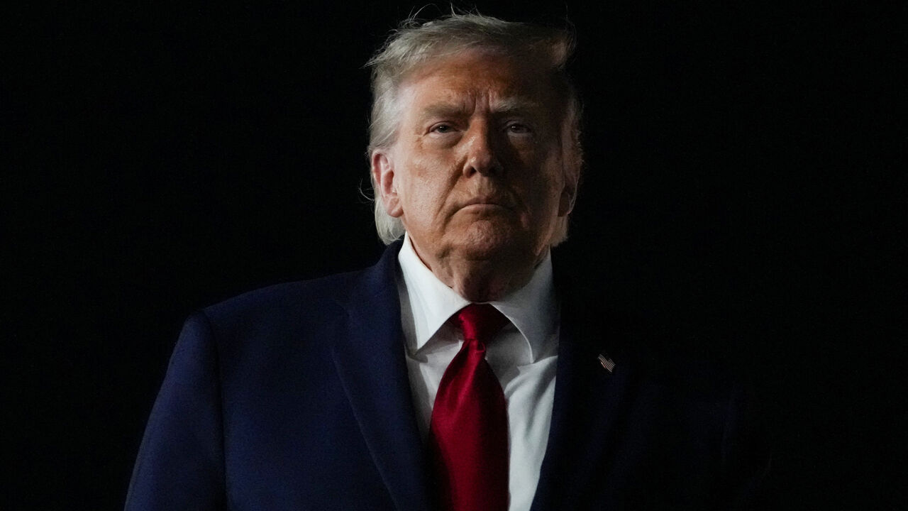 U.S. President Donald Trump looks on, as he returns after attending Game 3 of the NBA Finals, at John F. Kennedy International Airport in New York, U.S., June 8, 2026. REUTERS/Nathan Howard