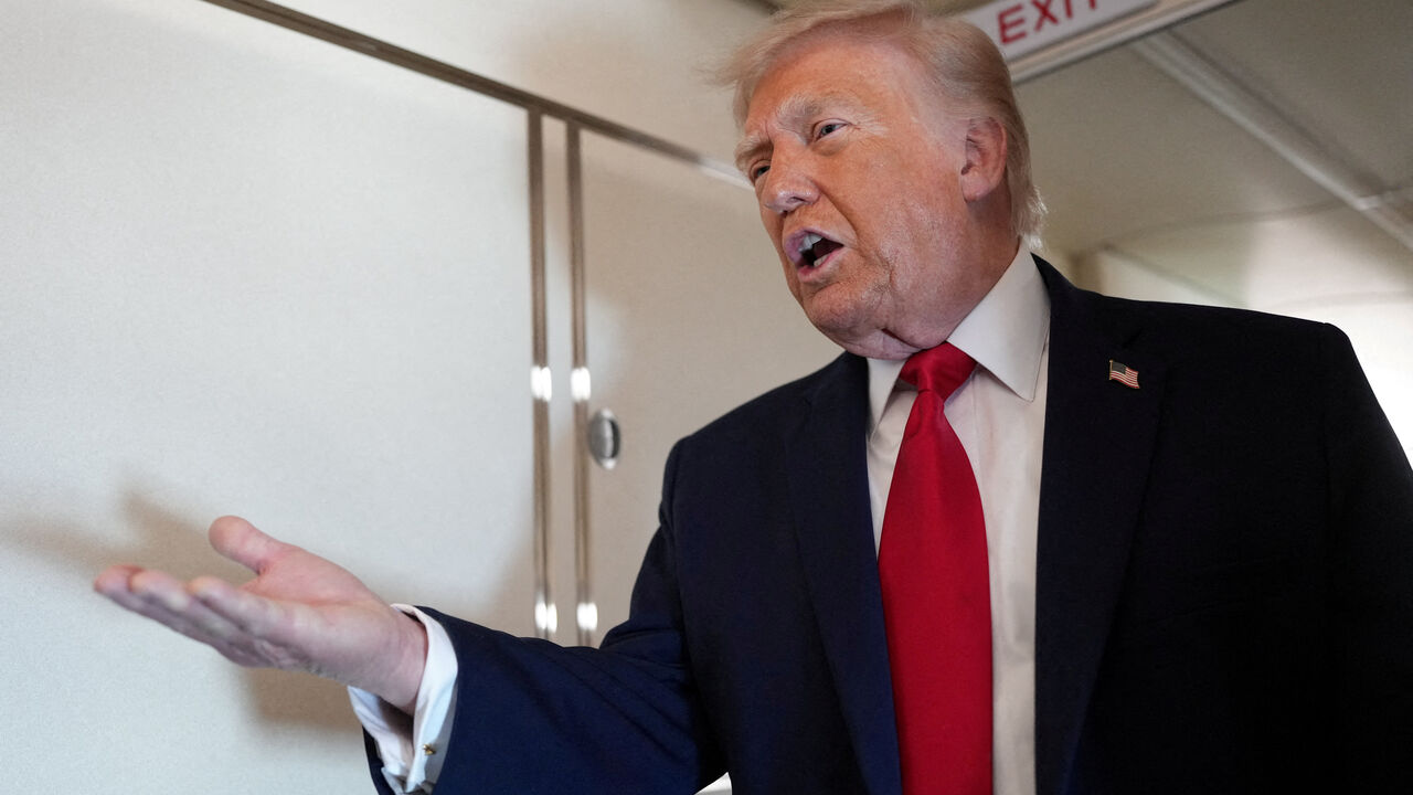 FILE PHOTO: U.S. President Donald Trump speaks to members of the media on board Air Force One while flying from Joint Base Andrews to Chippewa Valley Regional Airport in Eau Claire, Wisconsin, U.S., June 5, 2026. REUTERS/Nathan Howard/File Photo