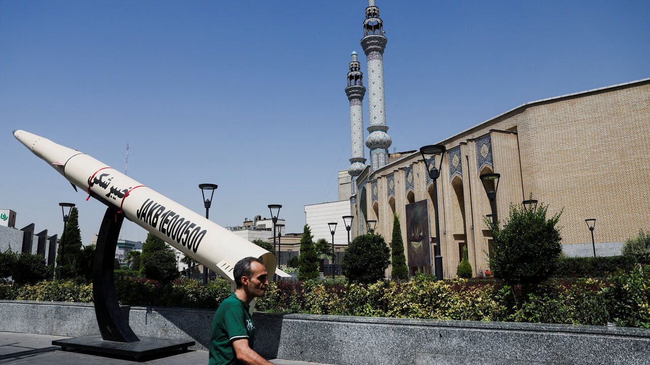 A man walks next to a symbolic mock-up of an Iranian missile, on a street in Tehran, Iran, June 11, 2026. Majid Asgaripour/WANA (West Asia News Agency) via REUTERS