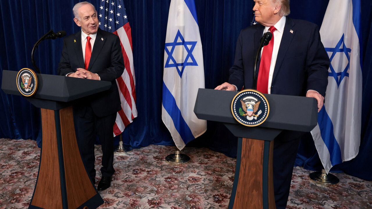 FILE PHOTO: U.S. President Donald Trump and Israeli Prime Minister Benjamin Netanyahu hold a press conference after meeting at Trump’s Mar-a-Lago club in Palm Beach, Florida, U.S., December 29, 2025. REUTERS/Jonathan Ernst/File Photo
