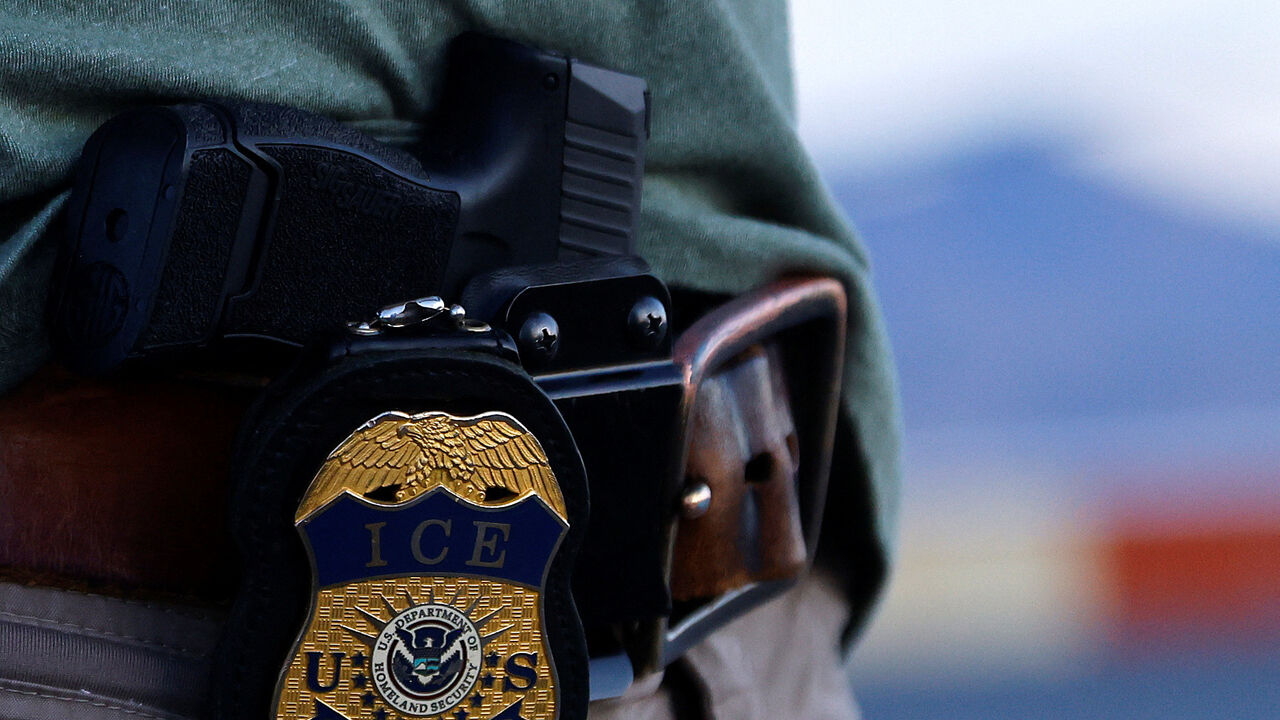 FILE PHOTO: The badge of a U.S. Immigration and Customs Enforcement (ICE) agent is seen at the airport in El Paso, Texas, U.S., May 10, 2023. REUTERS/Jose Luis Gonzalez/File Photo
