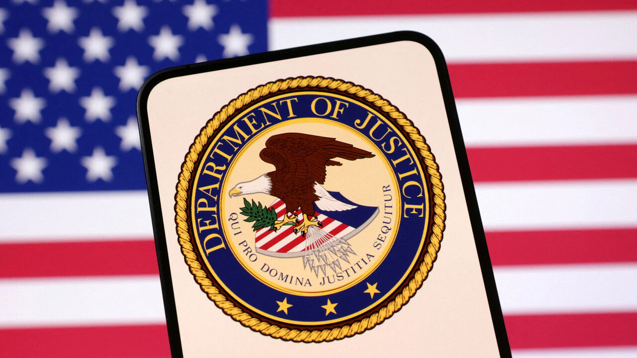 FILE PHOTO: United States Department of Justice logo and U.S. flag are seen in this illustration taken April 23, 2025. REUTERS/Dado Ruvic/Illustration/File Photo