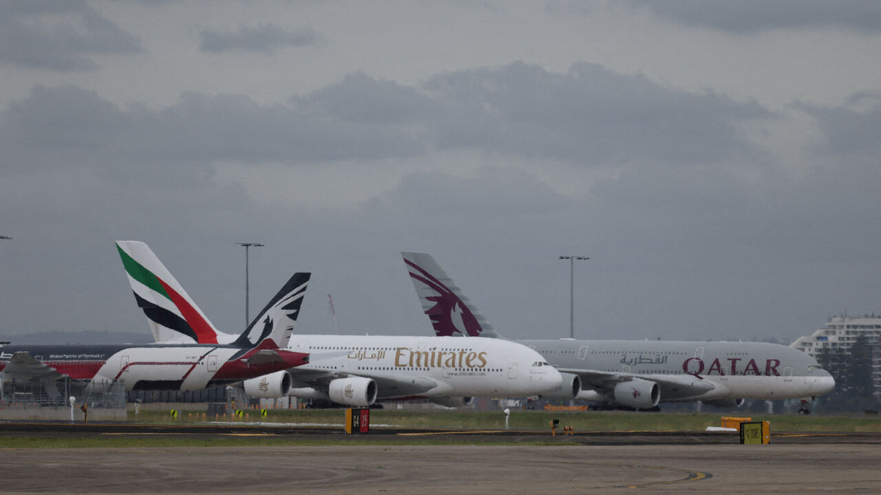 Emirates and Qatar Airways planes on the tarmac at Sydney Kingsford Smith Airport in Sydney, Australia, March 3, 2026. REUTERS/Hollie Adams