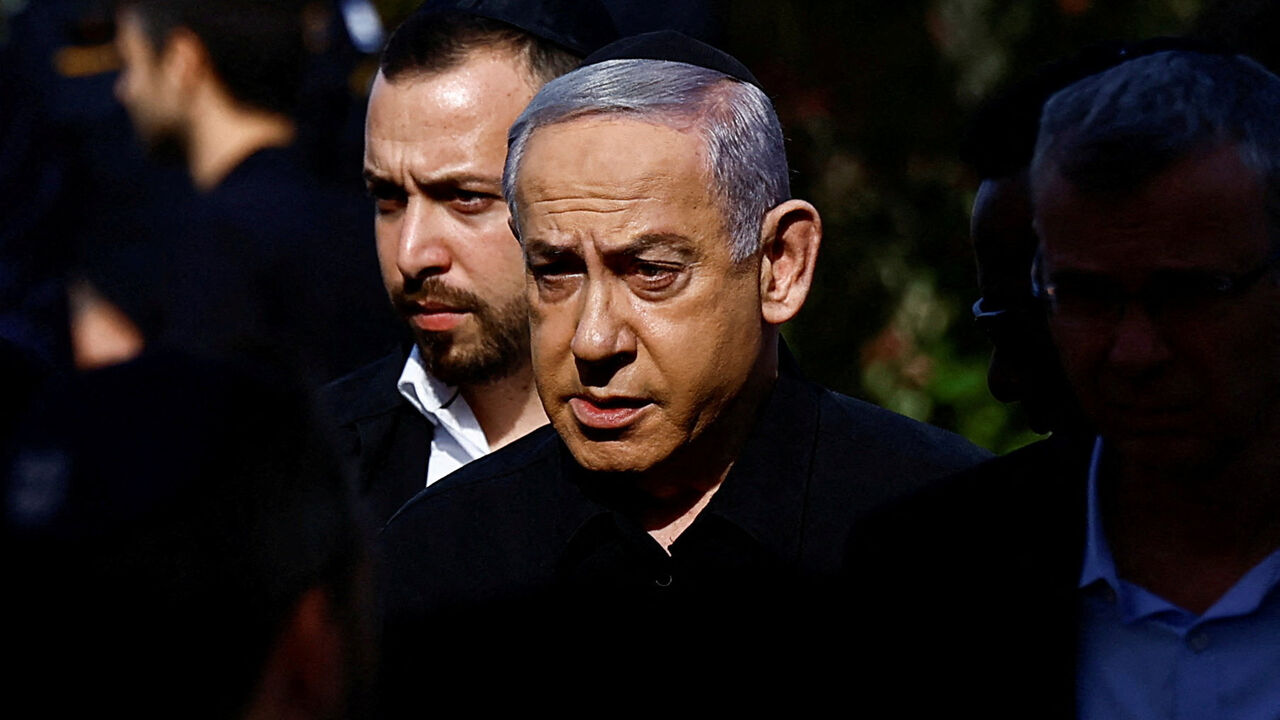 Israeli Prime Minister Benjamin Netanyahu attends the funeral of Gal Meir Eisenkot, 25, an Israeli solider and the son of Israeli cabinet minister and former military chief Gadi Eisenkot, who was killed in northern Gaza during the ongoing ground operation by Israel's military in the Gaza Strip, in Herzliya, Israel, December 8, 2023. REUTERS/Clodagh Kilcoyne