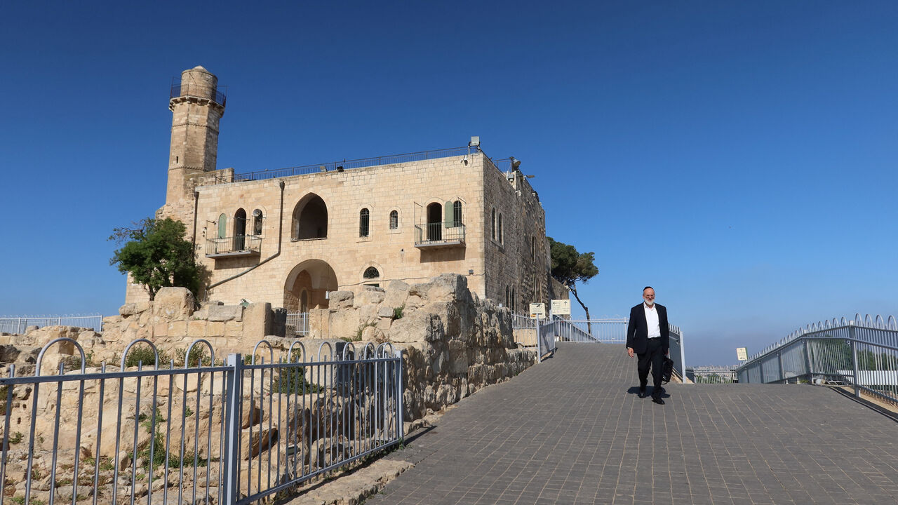 A Jewish man walks near Nabi Samuel mosque, a religious site that was run by the Muslim Waqf, and which Israel ordered the expropriation of, near Jerusalem, May 27, 2026. REUTERS/Sinan Abu Mayzer