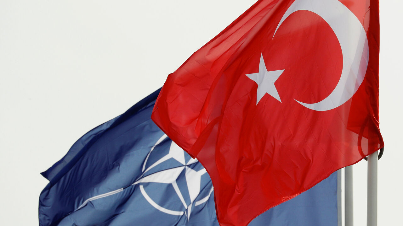 NATO and Turkish flags flutter at the Alliance headquarters in Brussels, Belgium, February 28, 2020.  REUTERS/Francois Lenoir