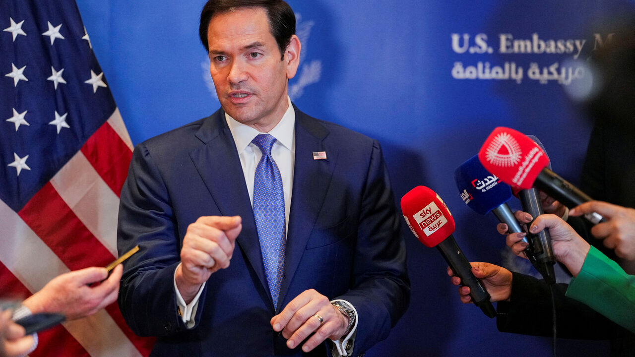FILE PHOTO: U.S. Secretary of State Marco Rubio speaks with members of the media before departing for Bahrain International Airport after his visit to the Middle East to discuss the interim deal between the U.S. and Iran with Arab Gulf allies, in Manama, Bahrain, June 25, 2026. REUTERS/Eric Lee/Pool/File Photo