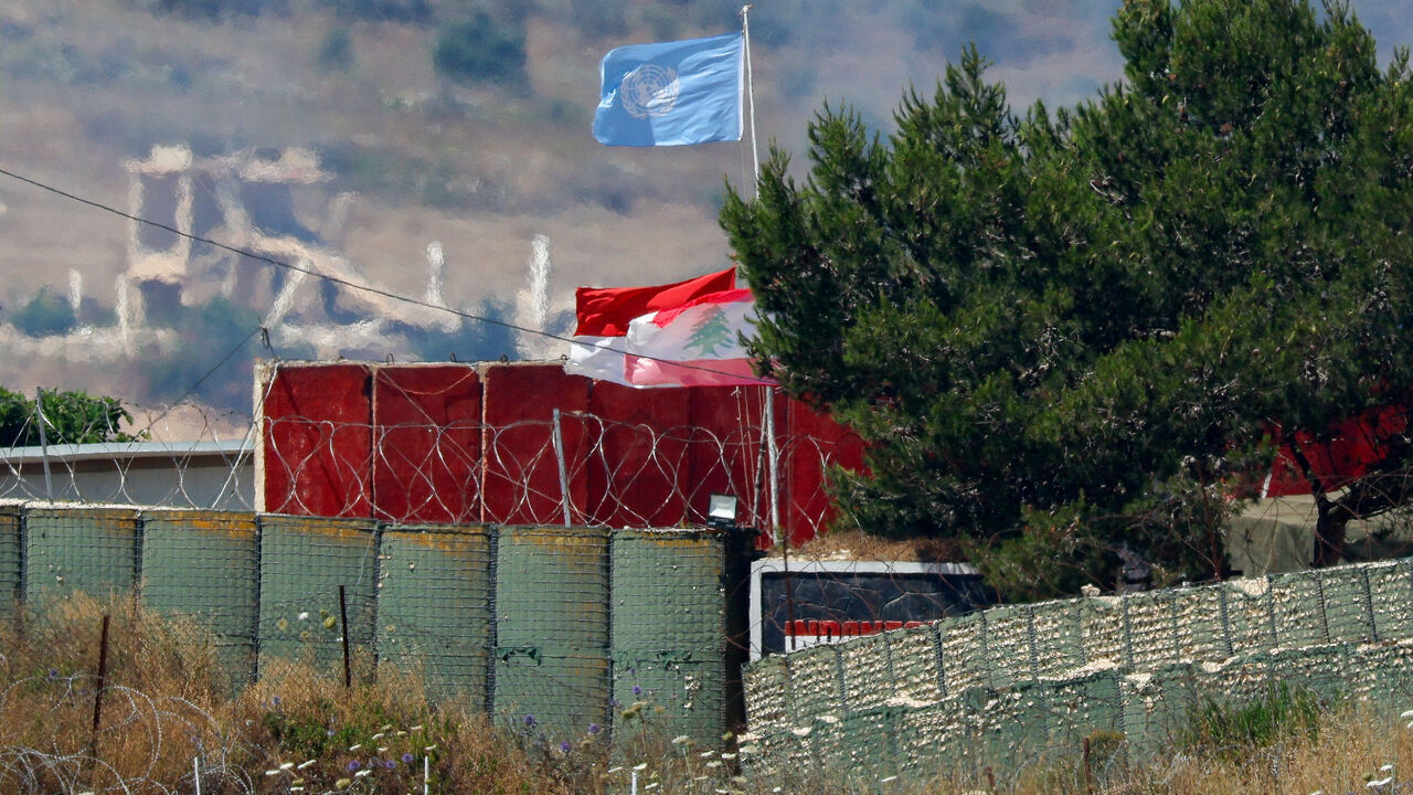 Flags, including a Lebanese flag and a United Nations (UN) flag, fly at a UN post in Lebanon, after Israel and Lebanon signed a framework agreement following U.S.-mediated talks, as seen from northern Israel, June 27, 2026. REUTERS/Amir Cohen