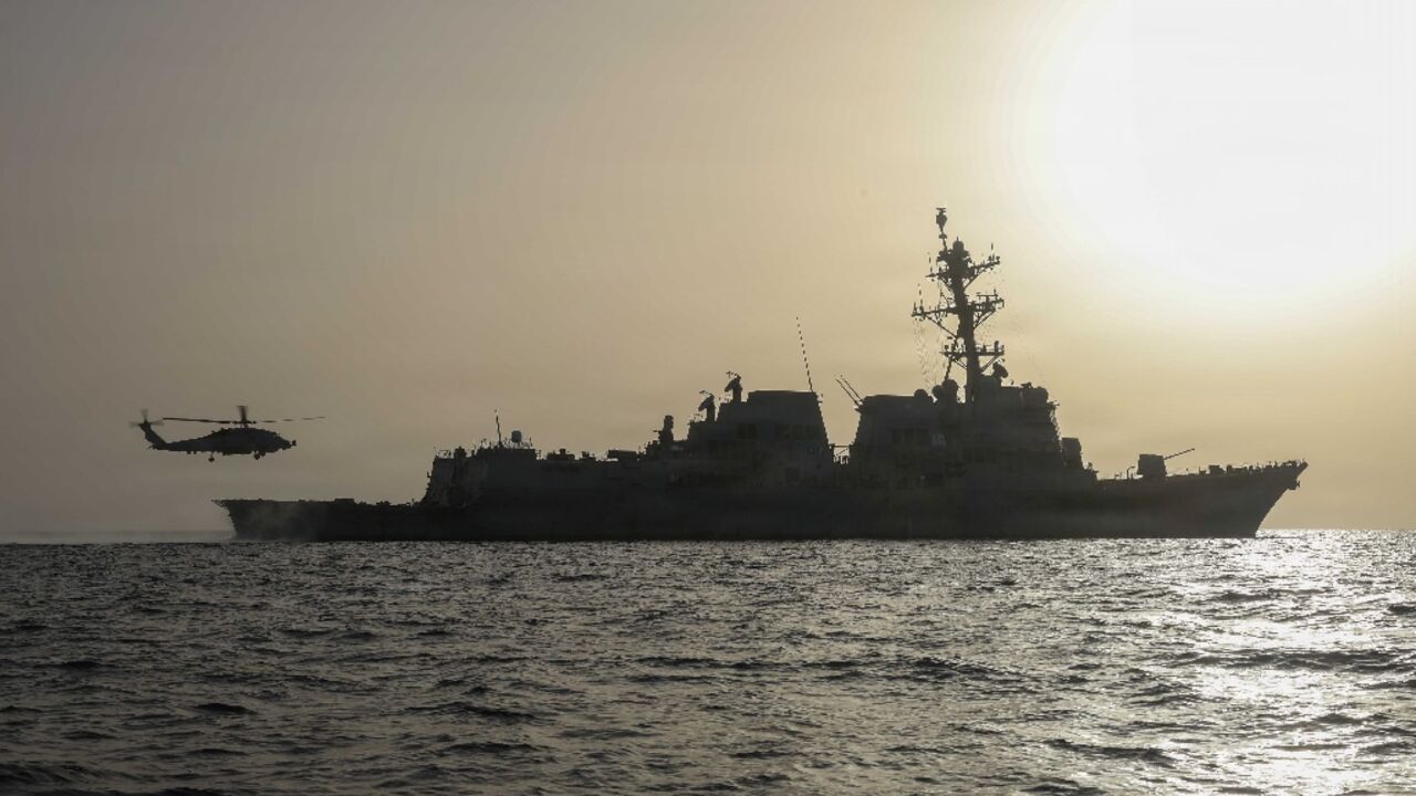 An MH-60R Sea Hawk, assigned to Helicopter Maritime Strike Squadron (HSM) 50, taking off of the flight deck of Arleigh Burke-class guided-missile destroyer USS Thomas Hudner
