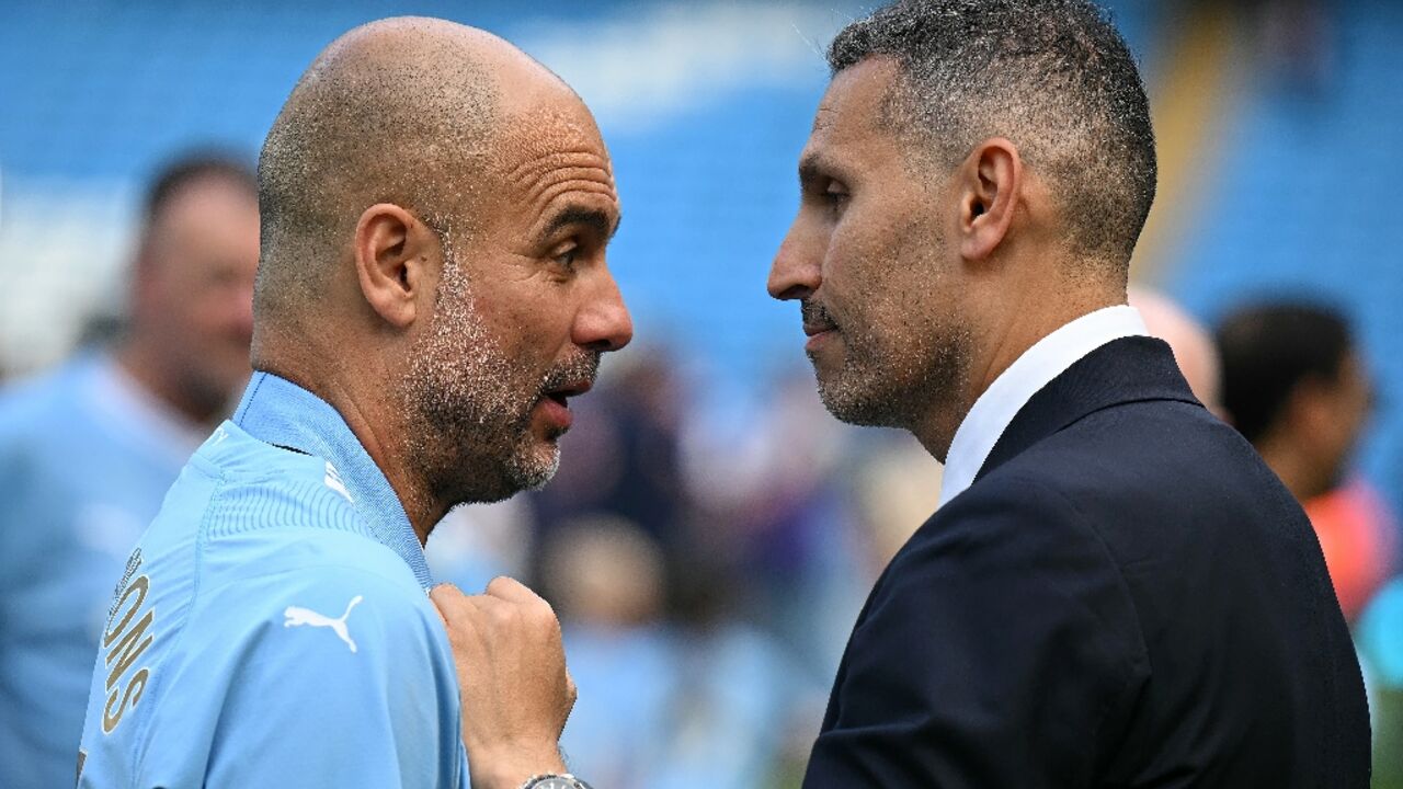 Pep Guardiola talks with Manchester City chairman Khaldoon Al Mubarak