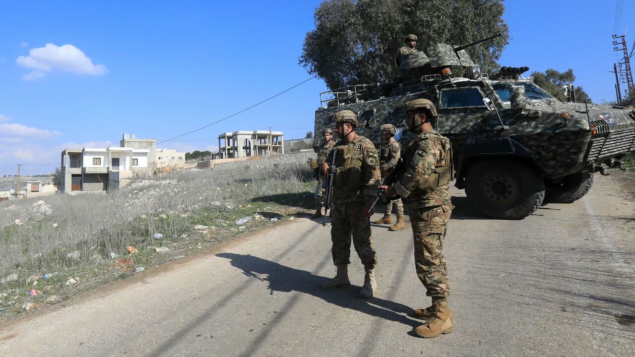 Lebanese army soldiers block a road to prevent residents of the southern Lebanese village of Mais al-Jabal from returning to their town on Jan. 27, 2025.
