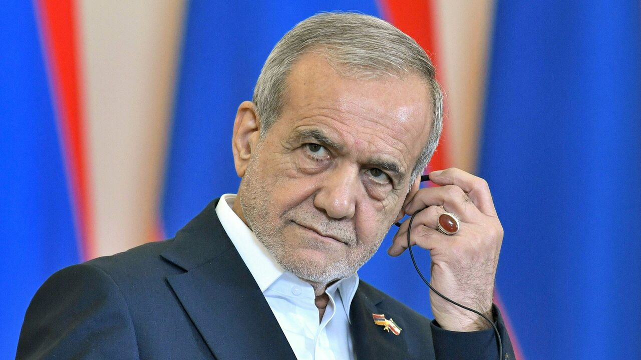 Iranian President Masoud Pezeshkian listens during a joint press conference alongside Armenia's Prime Minister in Yerevan on August 19, 2025.