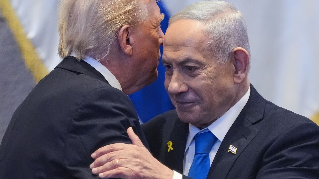 US President Donald Trump talks with Israeli Prime Minister Benjamin Netanyahu in the Knesset, Jerusalem, Oct. 13, 2025.