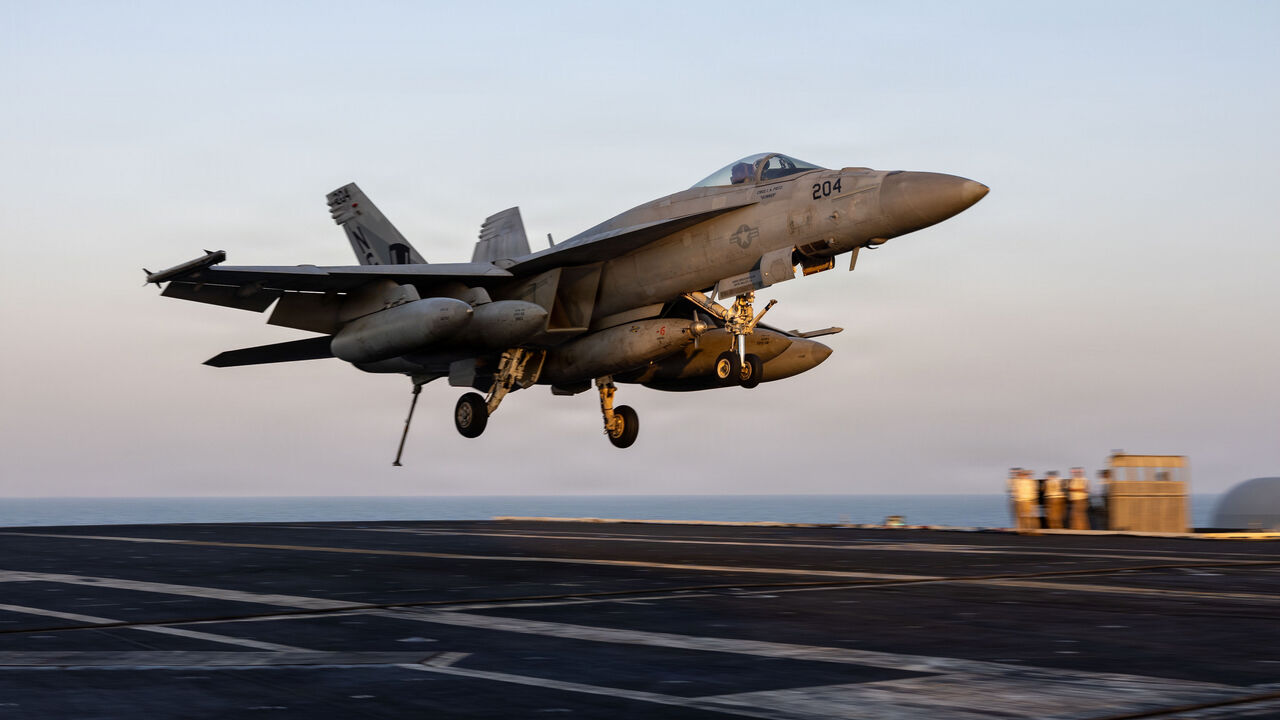  In this US Navy released handout, an F/A-18E Super Hornet, attached to Strike Fighter Squadron (VFA) 14, prepares to make an arrested landing on the flight deck of Nimitz-class aircraft carrier USS Abraham Lincoln (CVN 72) in support of Operation Epic Fury on March 1, 2026 at Sea. 